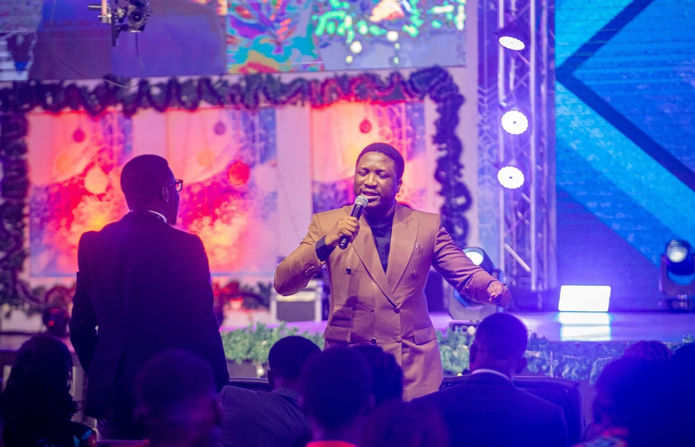 Teaching and ministration at a Caleb Dada Ministries gathering