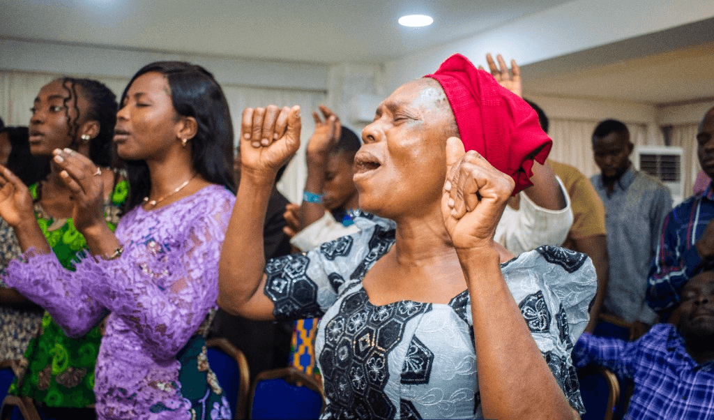 People worshiping at Caleb Dada Ministries